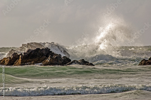 ocean waves crashing on rocks
