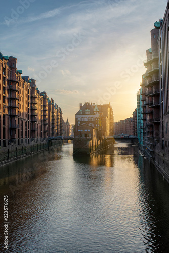 famous historic warehouse district Speicherstadt in Hamburg, Germany in golden sunlight © Christian Horz