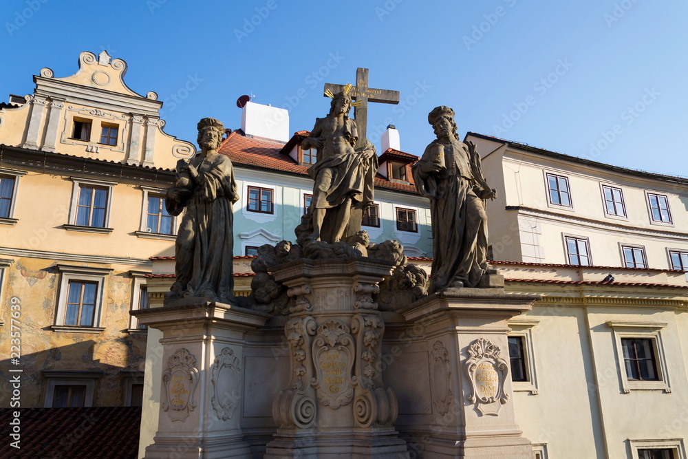 Statue of Holy Savior with Saints Cosmas and Damian detail on Charles Bridge, Prague, Czech Republic Statue of Holy Savior with Saints Cosmas and Damian detail on Charles Bridge, Prague, Czech Republic