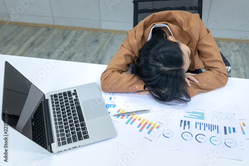 business woman work hard and sleeping in office workplace