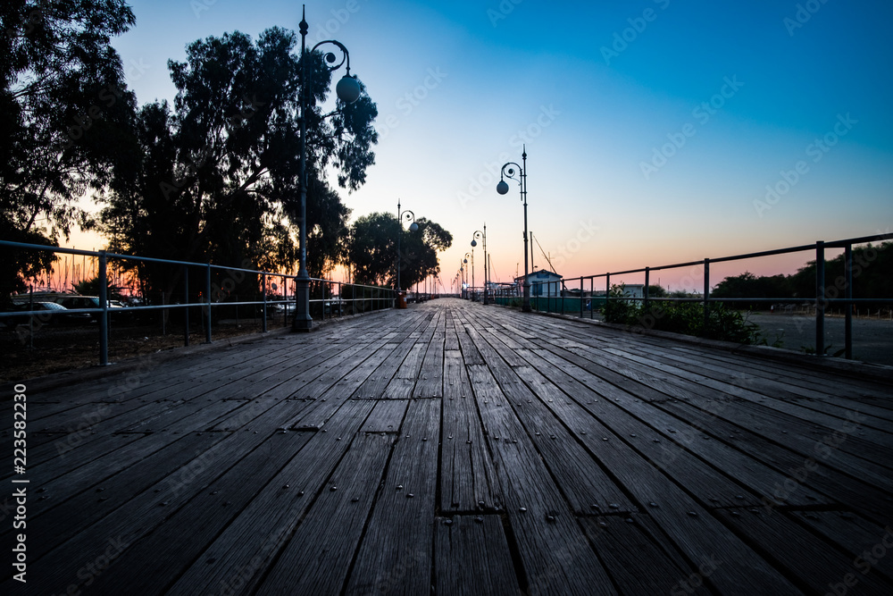 Dawn over the Wooden pier in early morning at Larnaca Cyprus