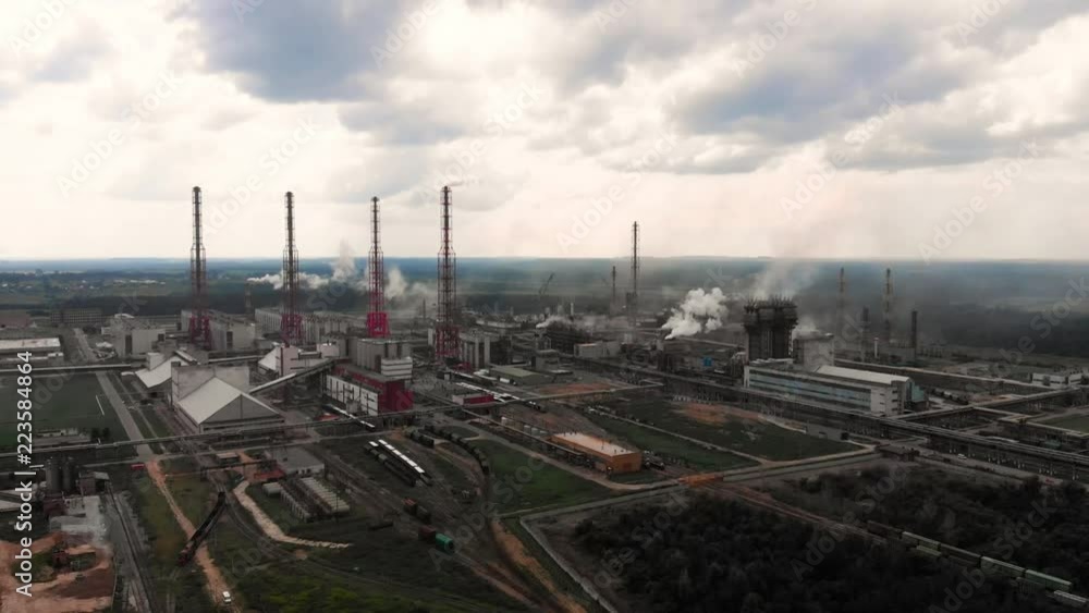 flight of the camera over the Oil refinery plant industry, Refinery factory, oil storage tank and pipeline steel with sunrise and cloudy sky background, Russia. flight of the camera over the Oil refinery plant industry, Refinery factory, oil storage tank and pipeline steel with sunrise and cloudy sky background, Russia.