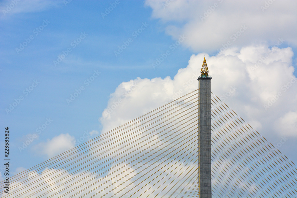 Rama VIII Bridge, top of modern concrete suspension bridge across Chao Phraya river with blue sky and clouds background, Bangkok, Thailand Rama VIII Bridge, top of modern concrete suspension bridge across Chao Phraya river with blue sky and clouds background, Bangkok, Thailand