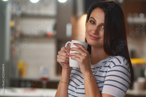 Girl with white cup in hands