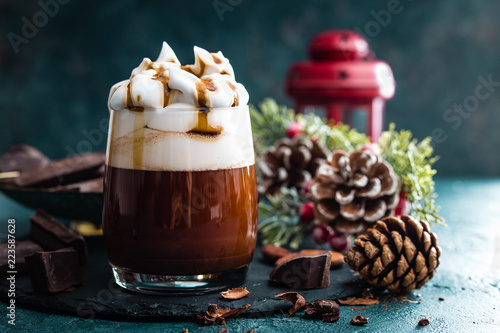 Hot chocolate with whipped cream. Chocolate drink and Christmas decorations