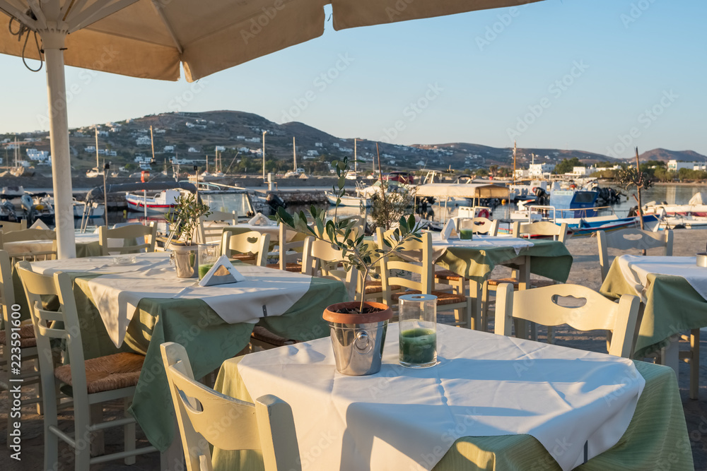 Cozy seaside outdoor restaurant in Parikia on Paros island, Cyclades, Greece