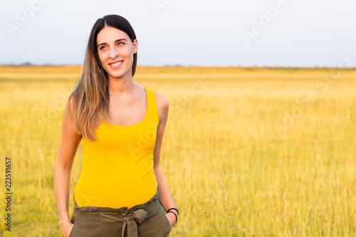 Portrait of beautiful woman in meadow