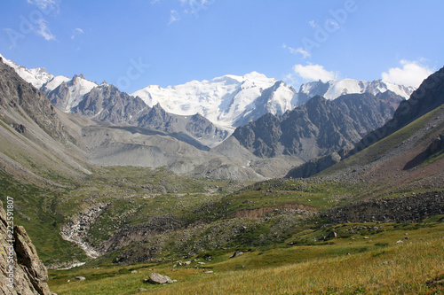 Snowy mountains with glacier with blue sky. Kazakhstan, Tian-shan