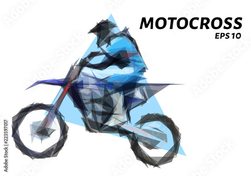 Rider on a motorcycle involved in motocross.Jumps and takes off on a springboard.