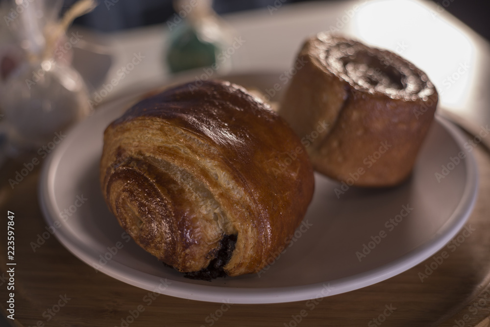 croissant with chocolate and coffee on wooden table croissant with chocolate and coffee on wooden table
