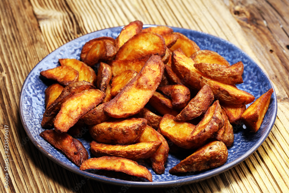 Baked potato wedges. homemade organic vegetable vegan vegetarian potato wedges snack food