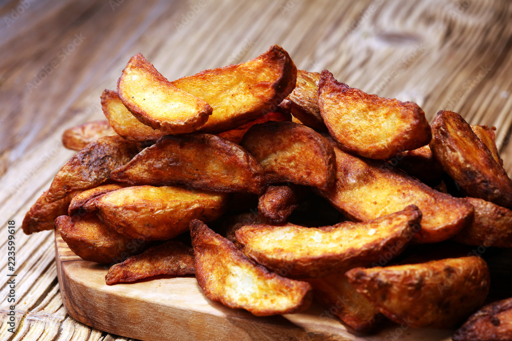 Baked potato wedges. homemade organic vegetable vegan vegetarian potato wedges snack food Baked potato wedges. homemade organic vegetable vegan vegetarian potato wedges snack food