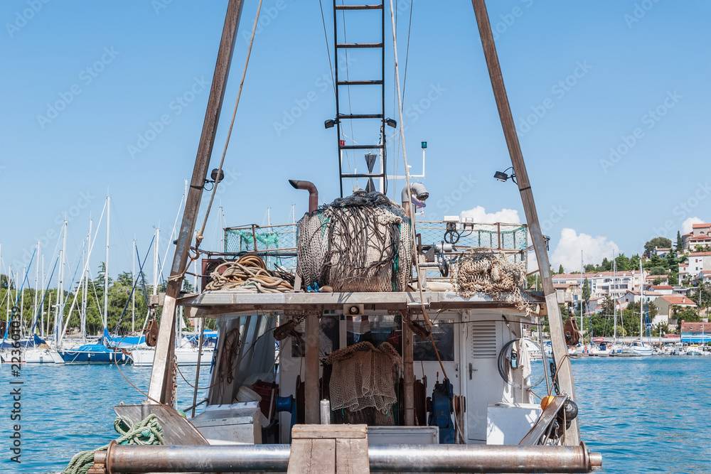 an old fishing boat is prepared to go out to sea for fishing. the quota for catching fish. small business