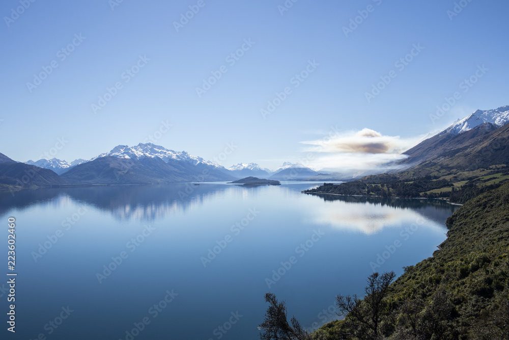 Peaceful view of scenic lake with mountains in the background