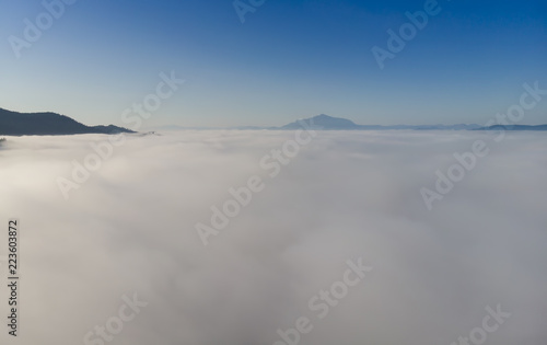 aerial view of mountain above clouds. Romania