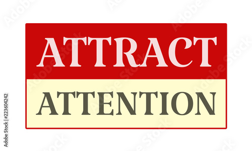 Attract Attention - written on red card on white background
