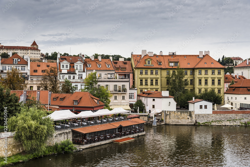 High angle view of buildings by Vltava river against sky in city High angle view of buildings by Vltava river against sky in city