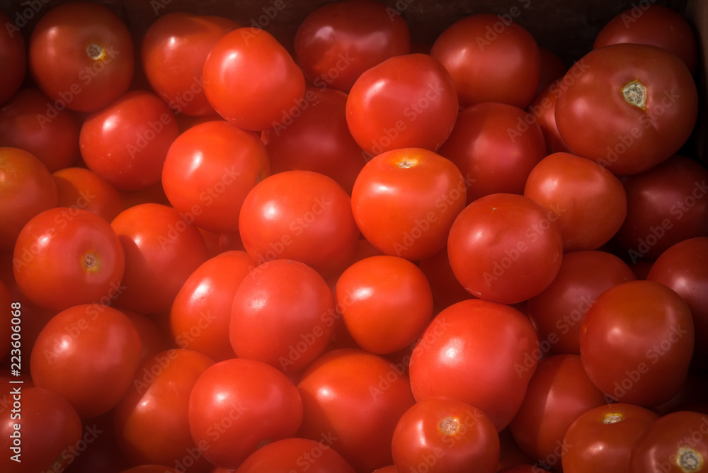 Red tomatoes background at open market . Red tomatoes background at open market .
