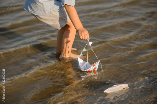 Three year old toddler boy playing on beach. Rest on summer vacation