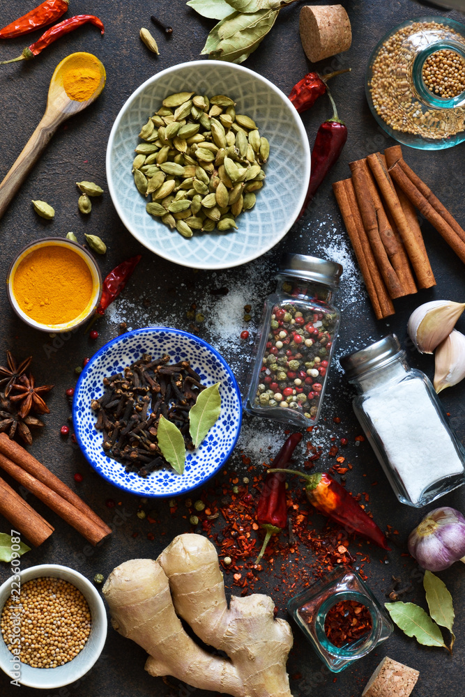 Mix of Asian spices: chili, ginger, garlic, cardamom, cinnamon. A set of spices for cooking. Mix of Asian spices: chili, ginger, garlic, cardamom, cinnamon. A set of spices for cooking.