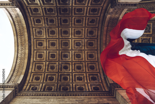 Low angle view of flag of France in Arc de Triomphe photo