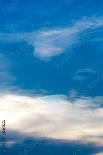 The sun shines on the sky from airplane, View on flight, bird eye view.Over the Clouds. Fantastic background with clouds and mountain peaks.rainbow on the cloud. rainbow in the heaven.