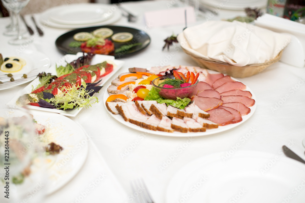 Meat assortment of beef, sausage and ham with greens Meat assortment of beef, sausage and ham with greens