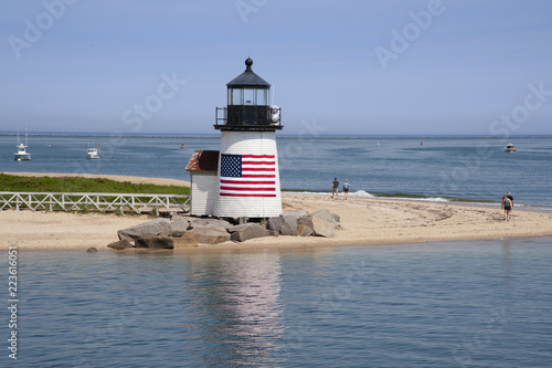 Nantucket Island Lighthouse with American Flag on Quiet Summer Day