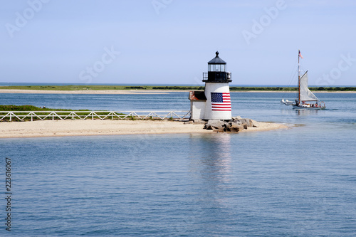 Sailing Past Lighthouse on Nantucket Island on a Summer Day