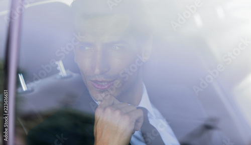 background image of the businessman in the car