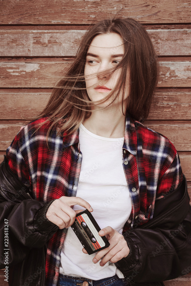 Portrait of a woman in rock grunge style. Filmed on the street
