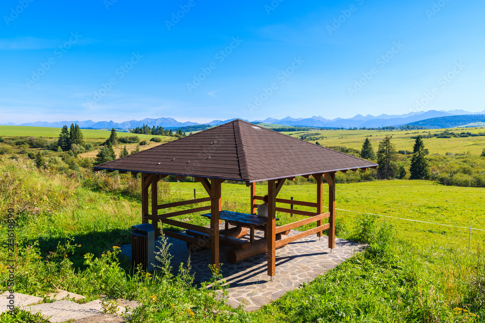 Wooden rest stop construction for cyclists on track around Tatra Mountains, Czarny Dunajec village, Poland Wooden rest stop construction for cyclists on track around Tatra Mountains, Czarny Dunajec village, Poland