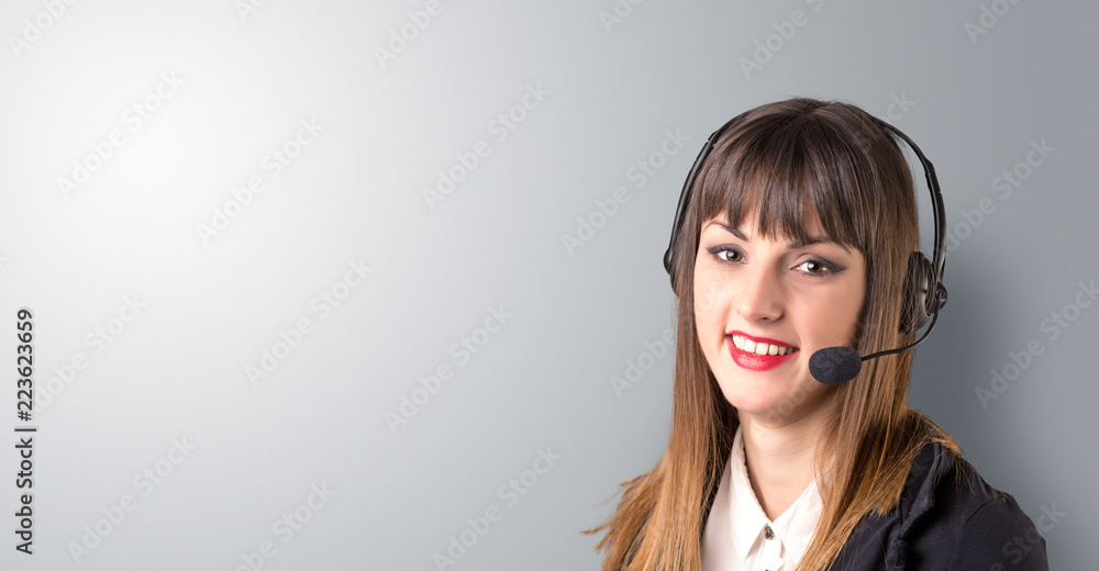Young female telemarketer on a white background Young female telemarketer on a white background