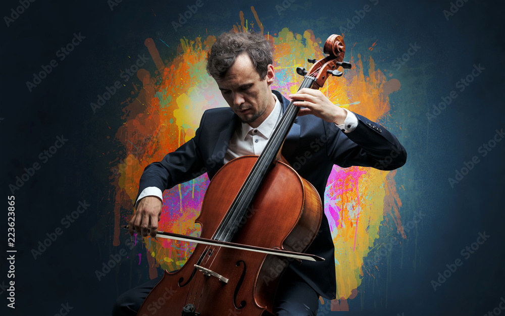 Young classical musician with colorful splotch wallpaper
