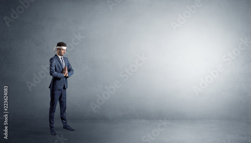 Small karate man fighting in an empty grey copy space © ra2 studio