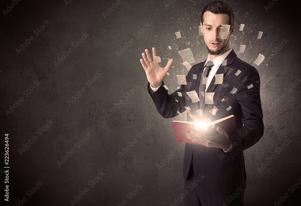 Man holding a book with document symbols around. Man holding a book with document symbols around.