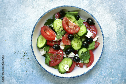 Vegetable salad with feta cheese and olive oil.Top view with copy space.