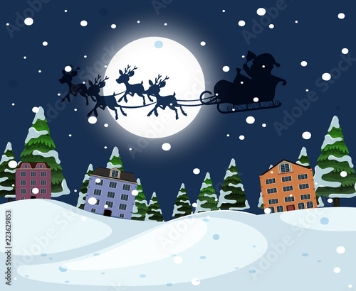 Silhouette santa riding sleigh over town