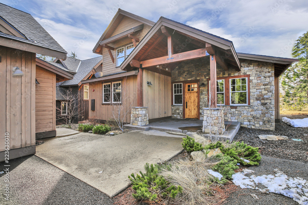 Beautiful home with wood and stone exterior, covered porch. Beautiful home with wood and stone exterior, covered porch.