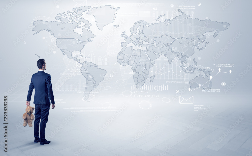 Businessman standing with his back and looking at a worldwide map with objects in his hand
Businessman standing with his back and looking at a worldwide map with objects in his hand