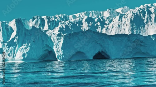 Ice floe floating in the ocean photo