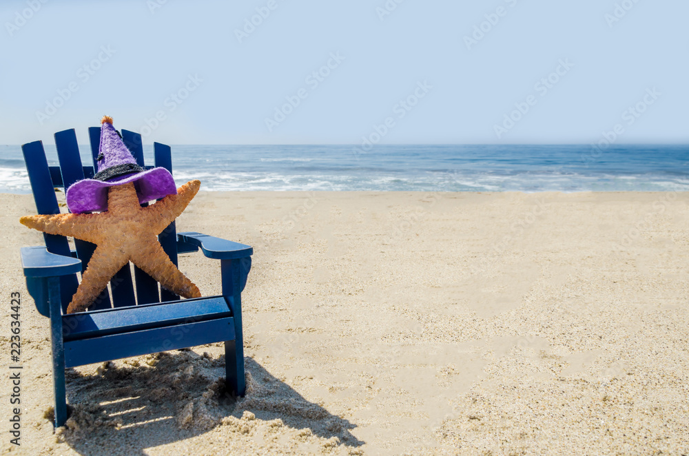 Halloween background on the beach with starfishes in witch's hats Halloween background on the beach with starfishes in witch's hats