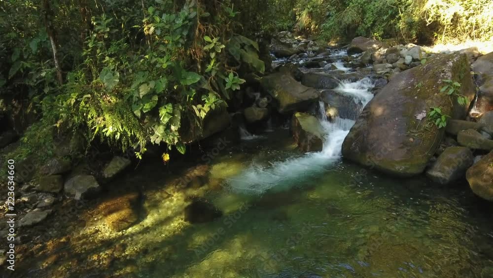 Flying over a waterfall in pristine montane rainforest at the Los Cedros Biological Reserve in western Ecuador Flying over a waterfall in pristine montane rainforest at the Los Cedros Biological Reserve in western Ecuador