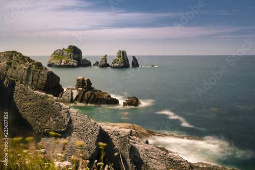 Preciosa vista de la costa cantabrica con sus inmensos islotes de roca y sus acantilados photo