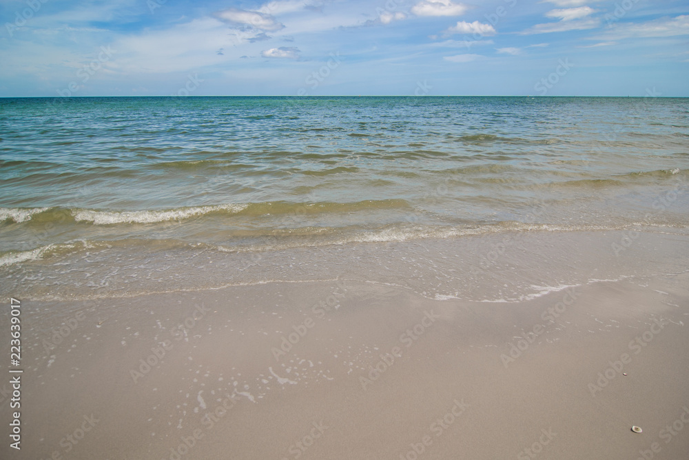 Gulf of thailand sea summer wave background. Exotic sea beach landscape with clouds on horizon. Natural tropical water paradise beach.Thailand beach nature relax. Travel tropical Hua hin, Thailand. Gulf of thailand sea summer wave background. Exotic sea beach landscape with clouds on horizon. Natural tropical water paradise beach.Thailand beach nature relax. Travel tropical Hua hin, Thailand.