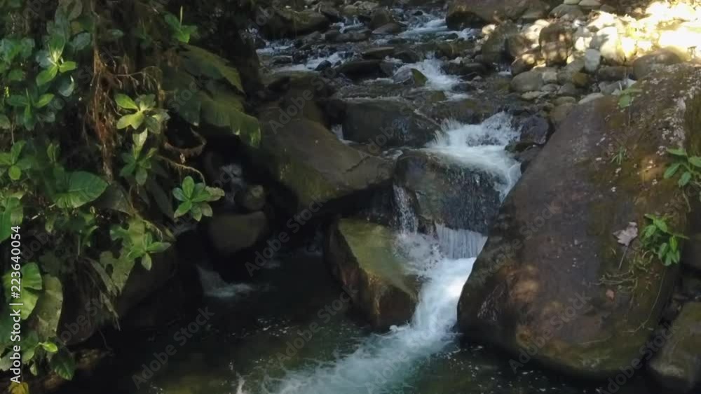 Slow motion aerial of a waterfall in pristine montane rainforest in the Los Cedros Biological Reserve, western Ecuador Slow motion aerial of a waterfall in pristine montane rainforest in the Los Cedros Biological Reserve, western Ecuador
