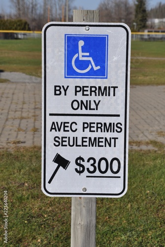 By permit only sign posted in parking area