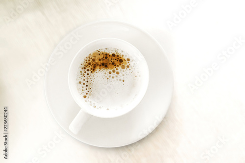 Cup of coffee on a white background top view.