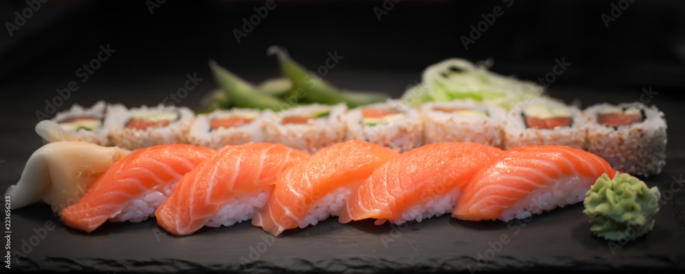 Sushi nigiri and salmon avocado roll with seasame Sushi nigiri and salmon avocado roll with seasame
