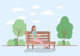beautiful woman sitting on park chair